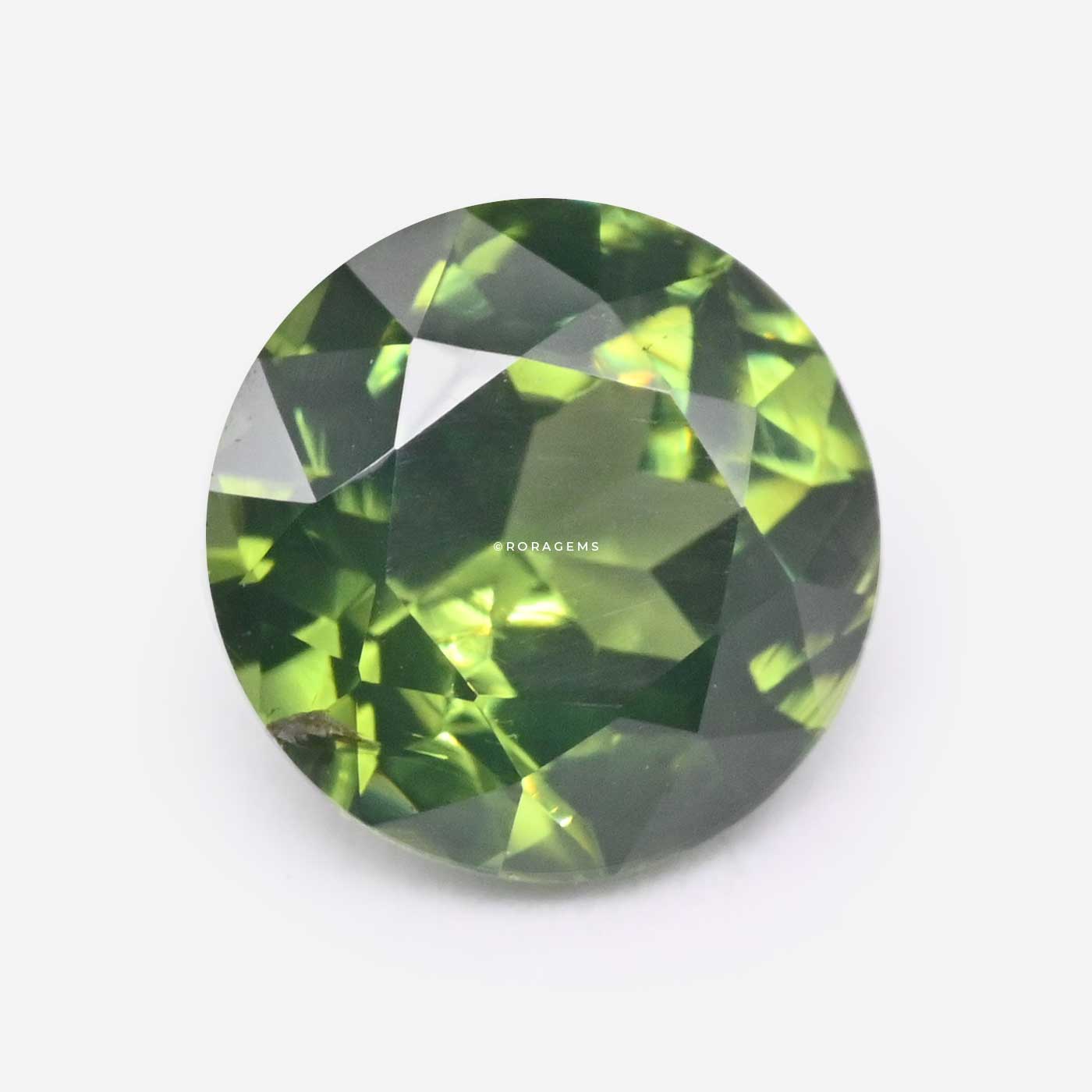 Natural 1 carat green zircon gemstone with a round shape, vibrant green color, and excellent brilliance.
