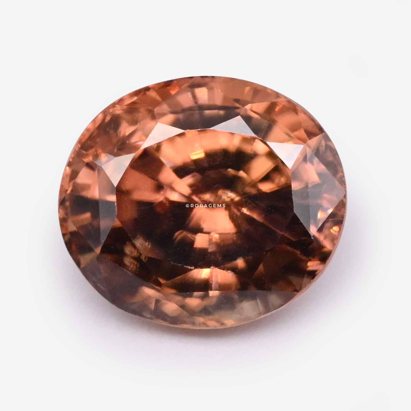 Oval brown-orange zircon gemstone with warm cinnamon tones available in colombo sri lanka