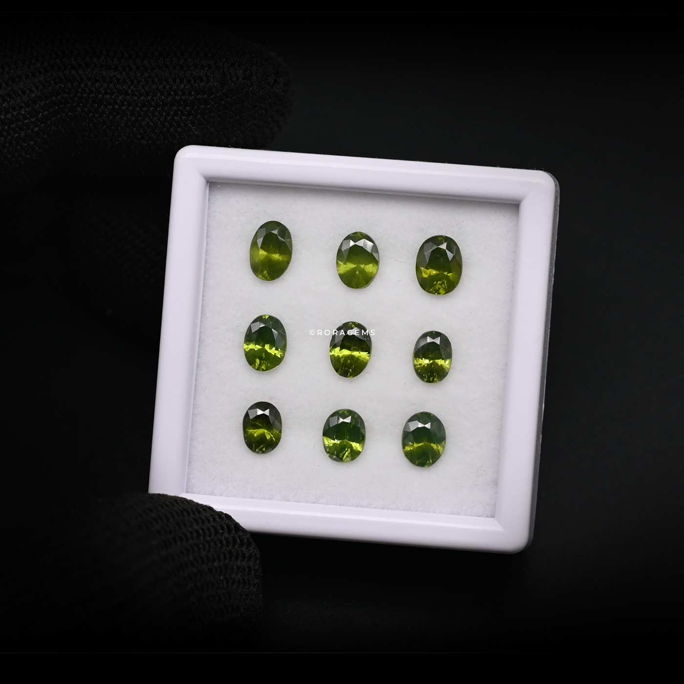 Green zircon parcel of gems for neckless, necklace designers with oval cuts offered as a matching nine-piece colombo gem market