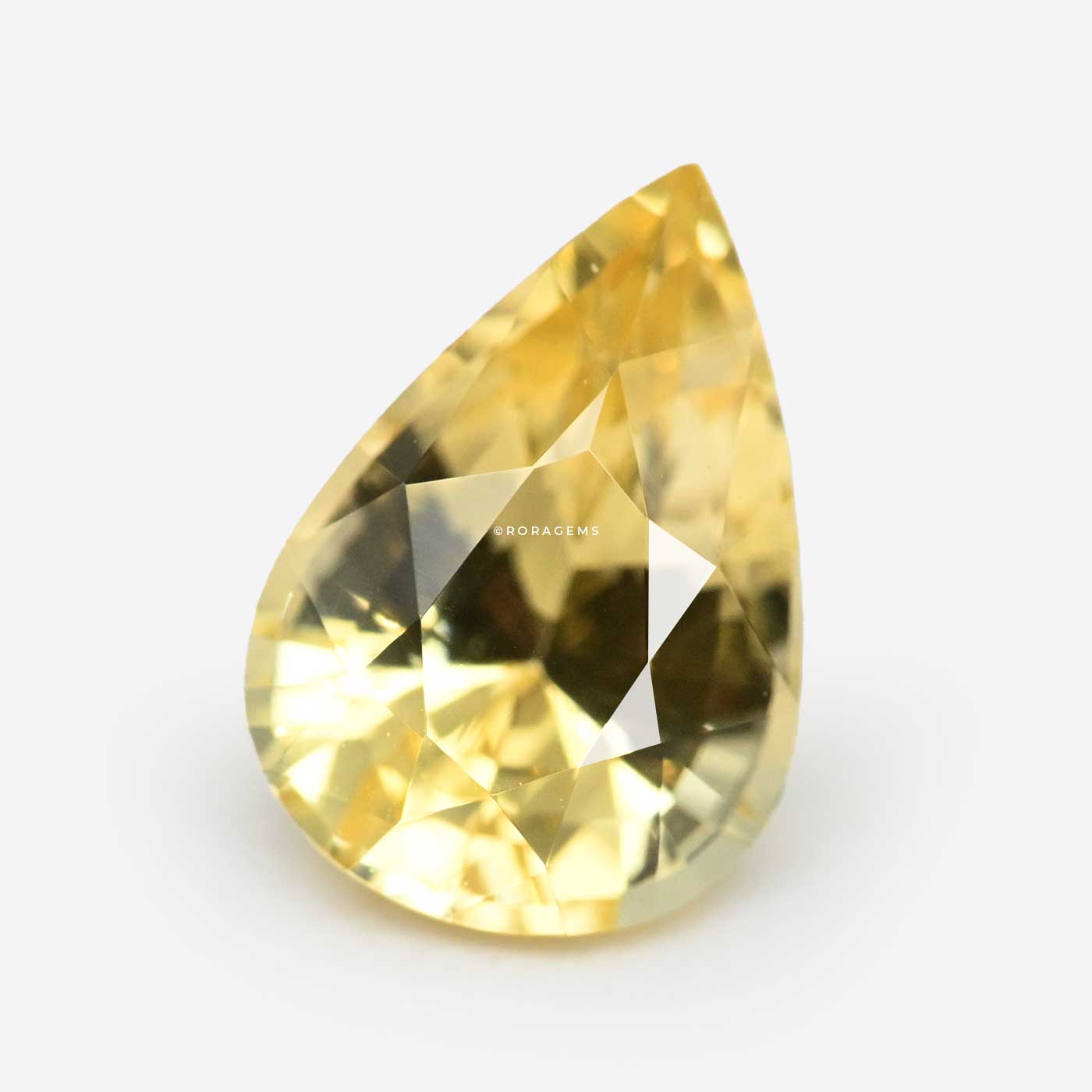 below 1 carat පුෂ්පරාග ගල් natural Ceylon yellow sapphire in pear shape with excellent golden yellow color buy colombo